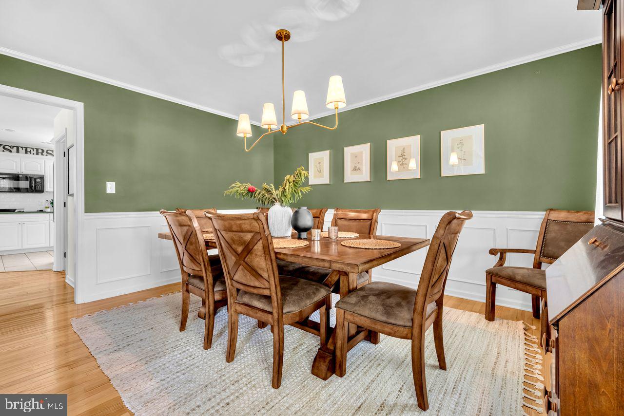 5616 Ryans Run Road East New Market, MD 21631 - Photo 23 of 57 Elegant dining space with green accents.