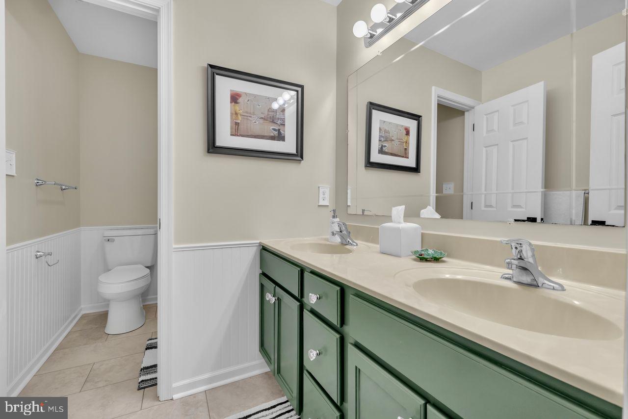 5616 Ryans Run Road East New Market, MD 21631 - Photo 36 of 56 a bathroom with a sink and a mirror