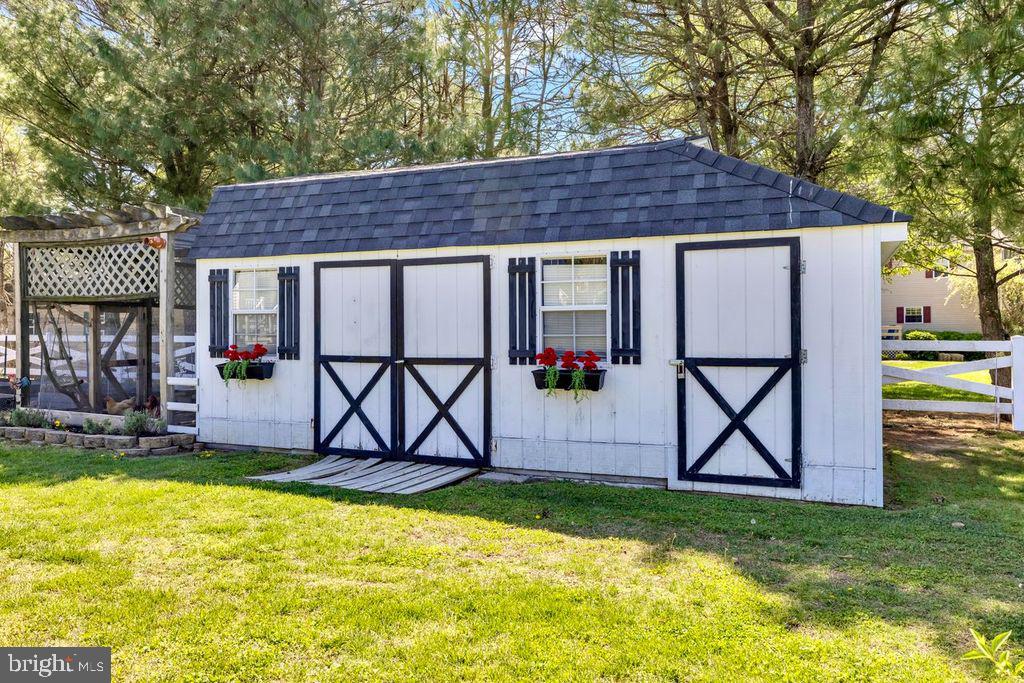 5616 Ryans Run Road East New Market, MD 21631 - Photo 39 of 57 Charming garden shed with floral accents.