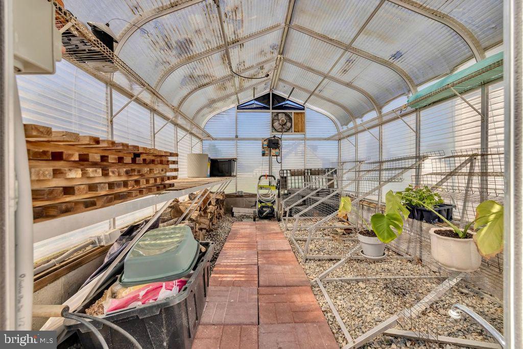 5616 Ryans Run Road East New Market, MD 21631 - Photo 50 of 57 Sunlit greenhouse for vibrant growth.