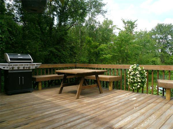 1164 Morgan Road West Springfield, MA 01089 - Photo 12 of 25 a view of a deck with table and chairs with wooden floor and fence