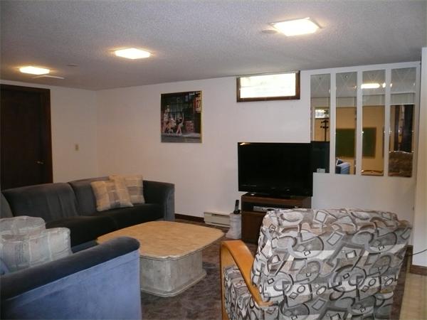1164 Morgan Road West Springfield, MA 01089 - Photo 17 of 25 a living room with furniture and a flat screen tv