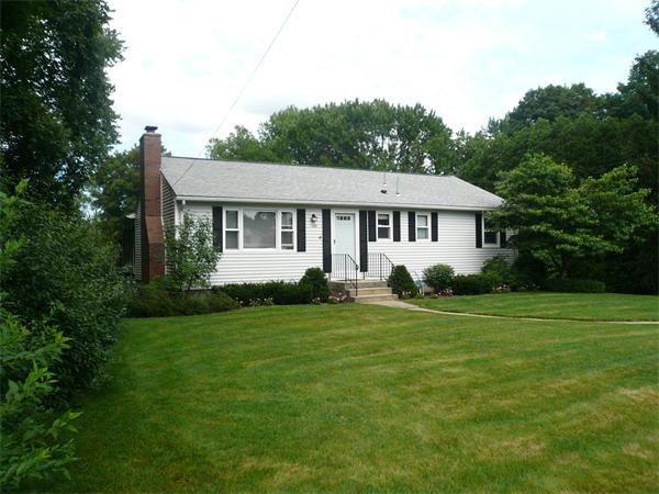 1164 Morgan Road West Springfield, MA 01089 - Photo 23 of 25 a front view of a house with a yard and trees