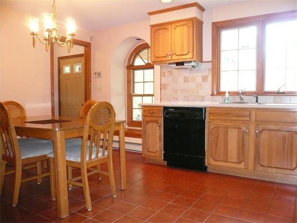 1164 Morgan Road West Springfield, MA 01089 - Photo 4 of 25 a kitchen with granite countertop a stove a sink and a refrigerator