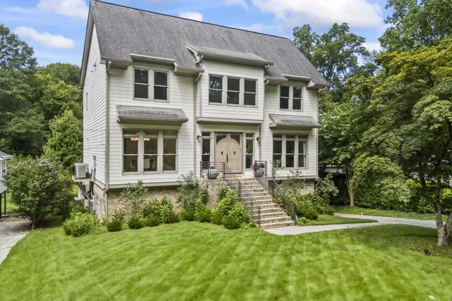 a front view of a house with a yard