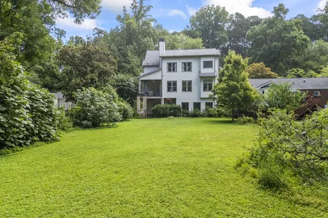 a kitchen with white cabinets and appliances