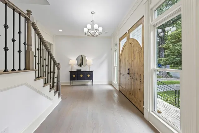 a living room with furniture a fireplace and a potted plant