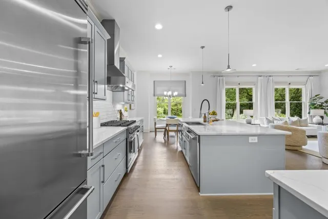 a bathroom with a granite countertop sink toilet and a mirror