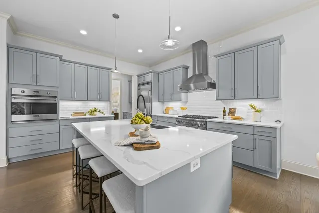 a utility room with sink dryer and washer