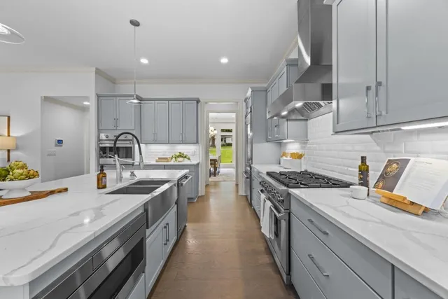 a bedroom with bed and a chandelier