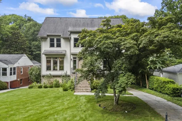 a front view of a house with a yard