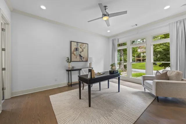 an aerial view of residential house with outdoor space and trees around