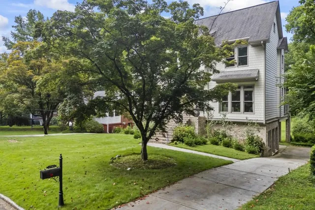 a view of a house with a yard