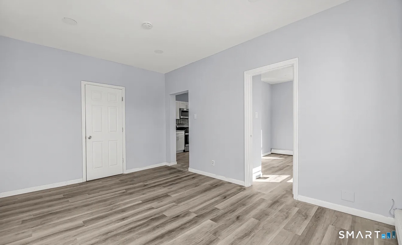 1220 Pembroke Street, Unit 3R Bridgeport, CT 06608 - Photo 10 of 12 a view of a room with wooden floor