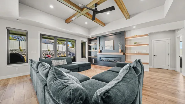 a living room with furniture and wooden floor