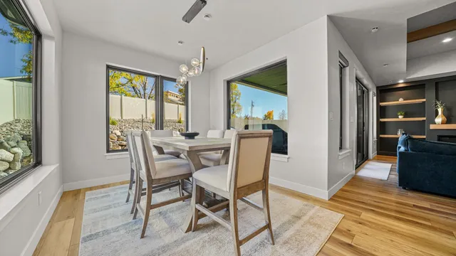 a view of a dining room with furniture window and wooden floor