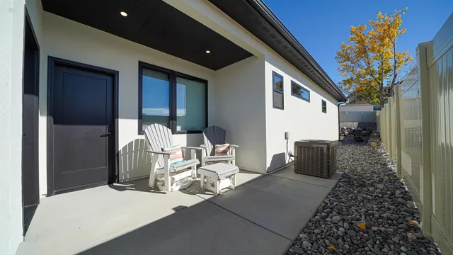 a balcony with furniture and a potted plant