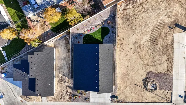 a view of a door and a tree front of the house