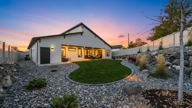 a view of a house with a backyard