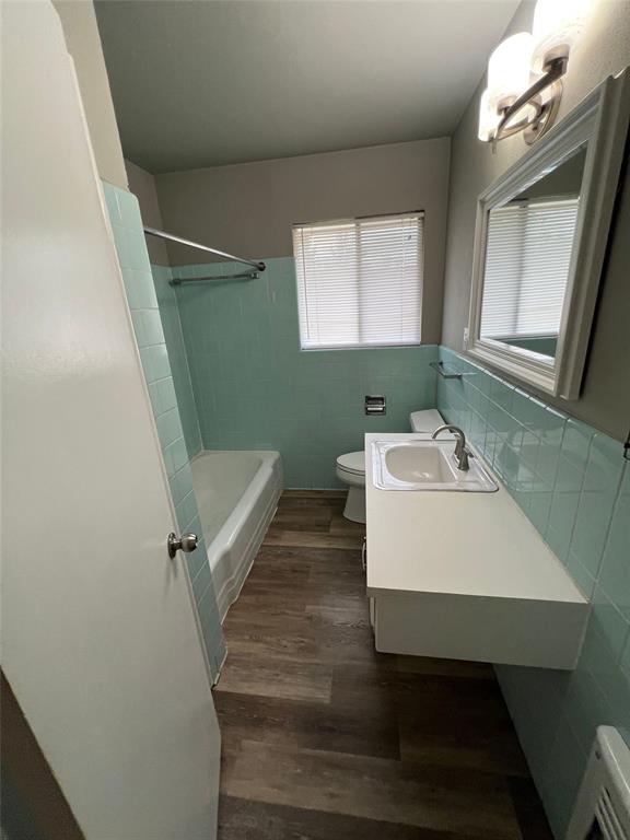 105 Oak Ridge Terrace Weatherford, TX 76086 - Photo 12 of 21 a bathroom with a sink a toilet and a mirror