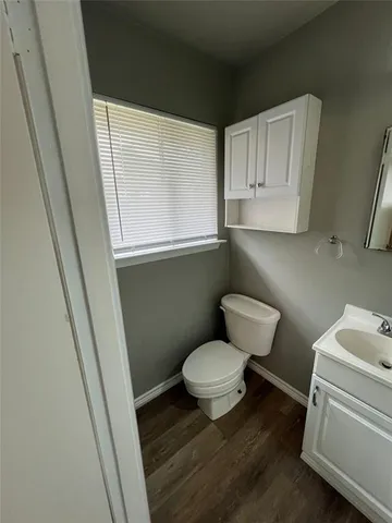 a bathroom with a toilet and a sink
