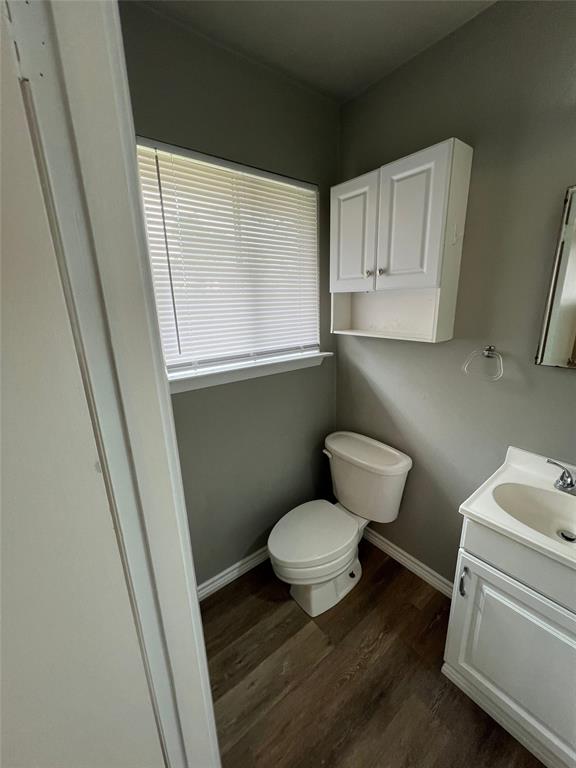 105 Oak Ridge Terrace Weatherford, TX 76086 - Photo 16 of 21 a bathroom with a toilet and a sink