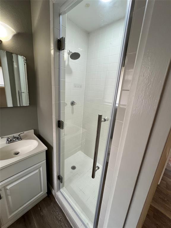 105 Oak Ridge Terrace Weatherford, TX 76086 - Photo 17 of 21 a bathroom with a sink a toilet a shower a mirror and vanity