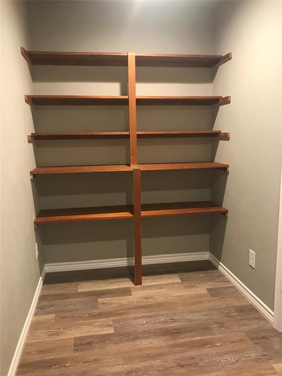 105 Oak Ridge Terrace Weatherford, TX 76086 - Photo 8 of 21 a view of walk in closet with empty racks
