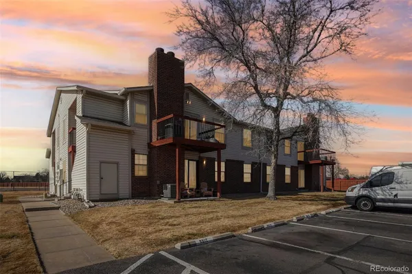 a view of a house with snow on the road