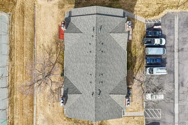 an aerial view of residential houses with outdoor space