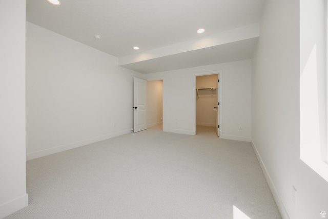5902 Canyon Rim Road, Unit 620 Lehi, UT 84048 - Photo 68 of 78 Spacious room featuring light-toned carpeting, recessed ceiling lighting, and a walk-in closet with built-in shelving