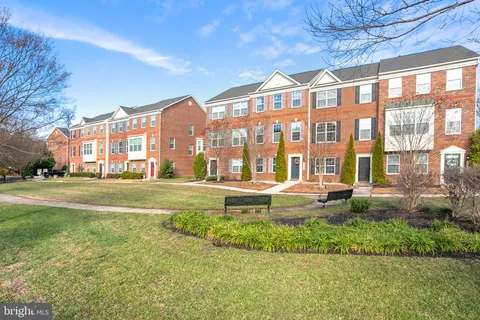 a view of a house with a yard patio and sitting area