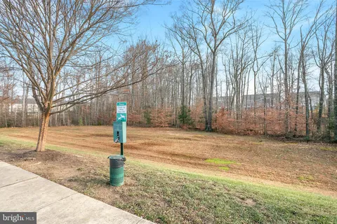 a sign board with yard in front of it