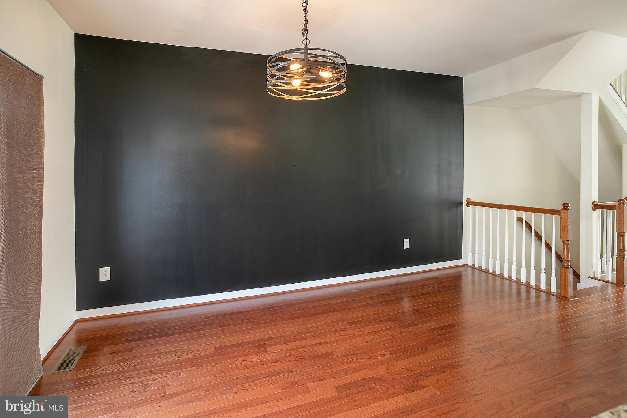 2885 Falkirk Alley Bryans Road, MD 20616 - Photo 8 of 43 a view of an empty room with wooden floor