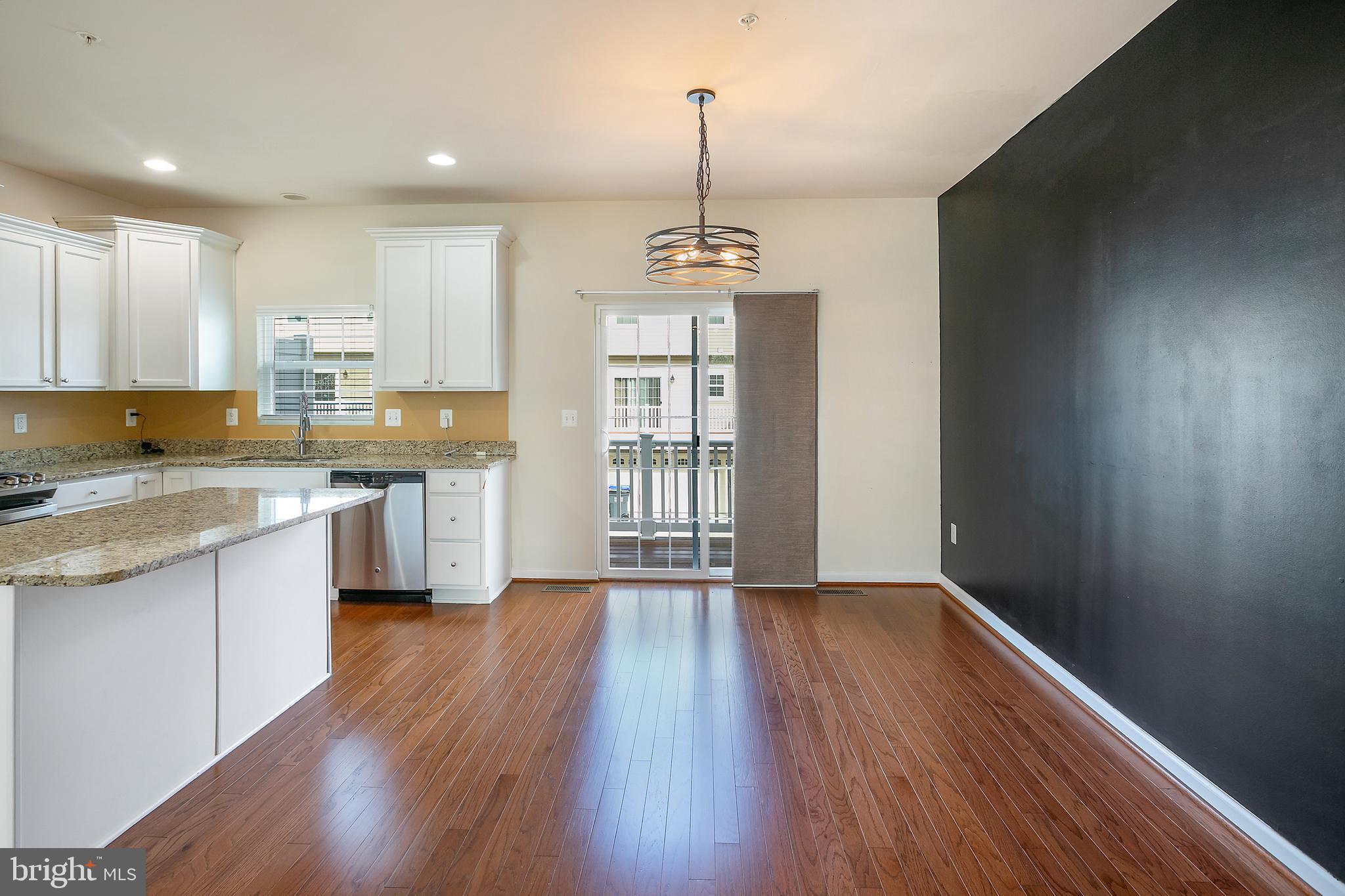 2885 Falkirk Alley Bryans Road, MD 20616 - Photo 10 of 43 a view of kitchen with wooden floor and window