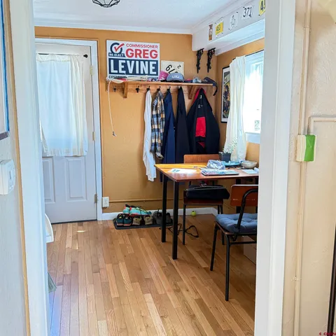 a picture of a bench in front of a door