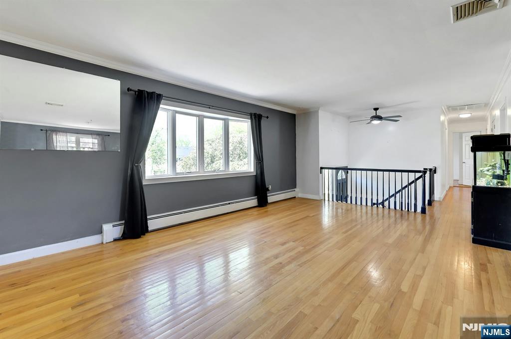 20 Blue Hill Road Norwood, NJ 07648 - Photo 7 of 49 wooden floor in an empty room with a window
