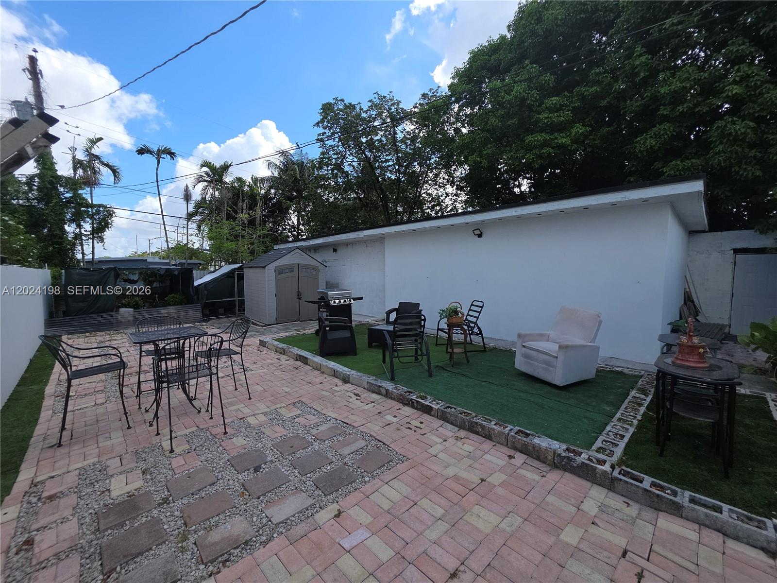 651 East 48th Street Hialeah, FL 33013 - Photo 26 of 52 a view of a backyard with sitting area