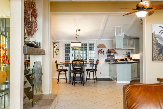 a kitchen with stainless steel appliances a sink and a refrigerator