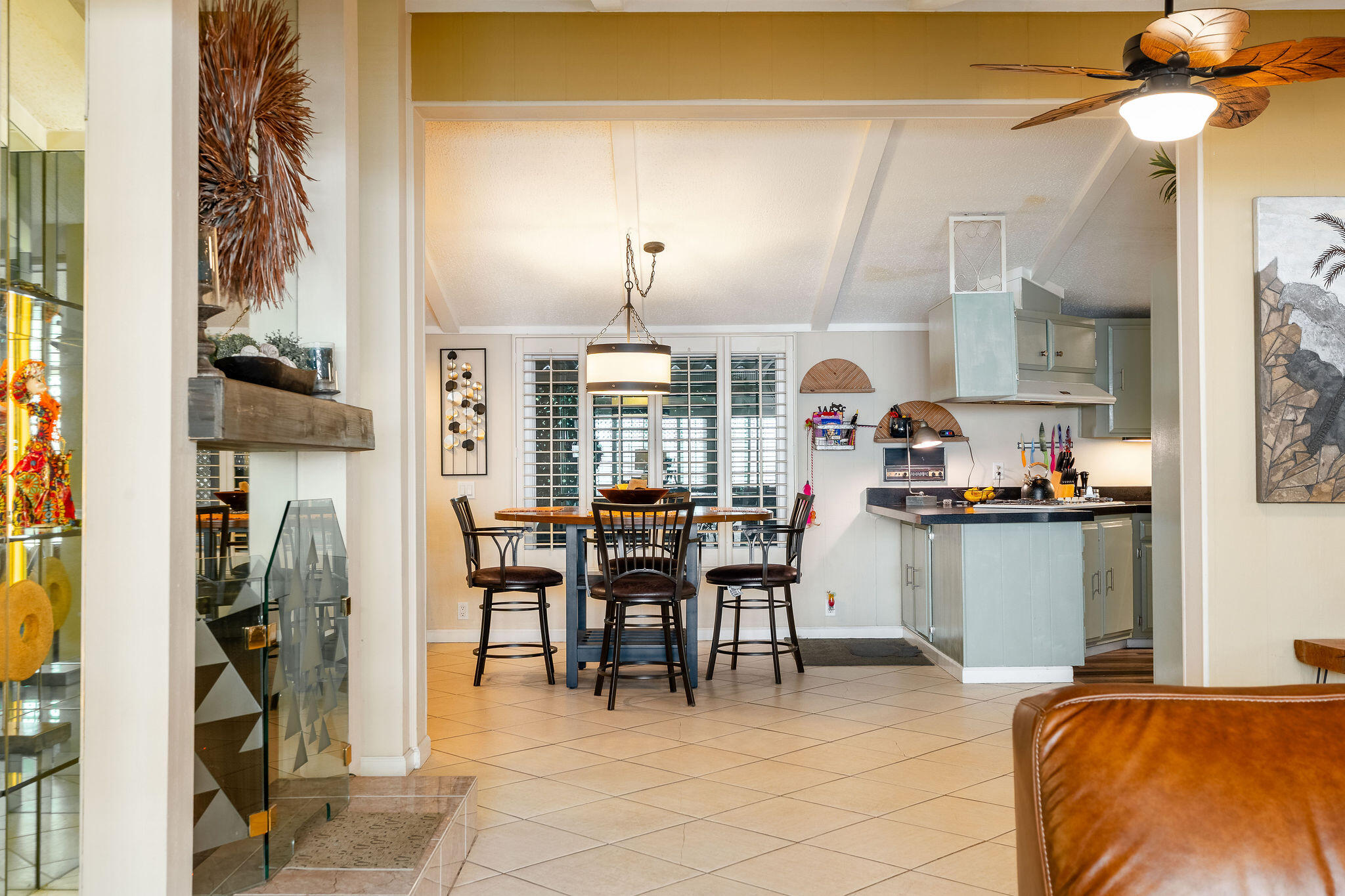 109 International Boulevard Rancho Mirage, CA 92270 - Photo 14 of 64 a living room with furniture a chandelier and a dining table
