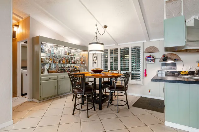 a kitchen with stainless steel appliances a sink and cabinets