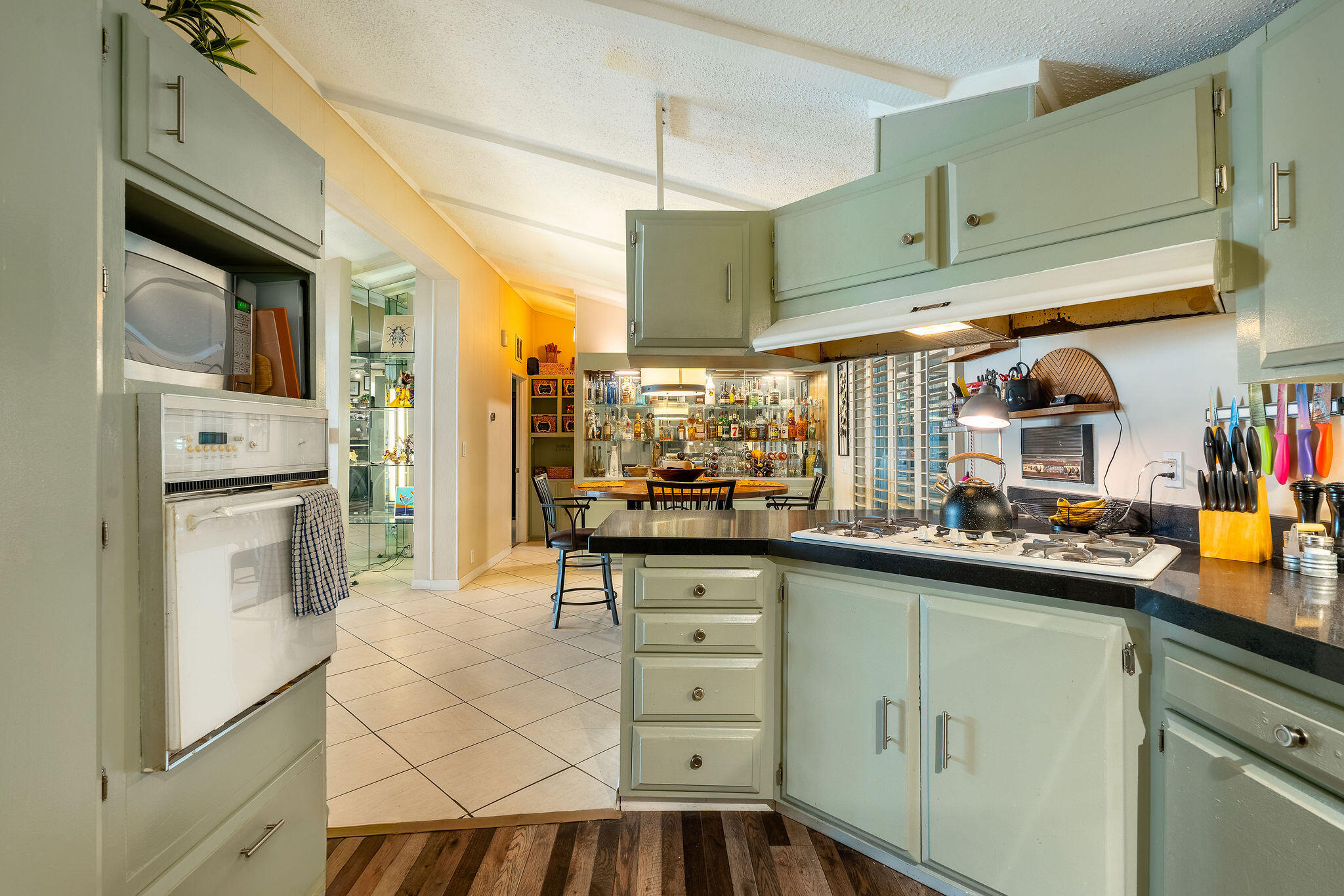 109 International Boulevard Rancho Mirage, CA 92270 - Photo 20 of 64 a kitchen with stainless steel appliances a sink and cabinets