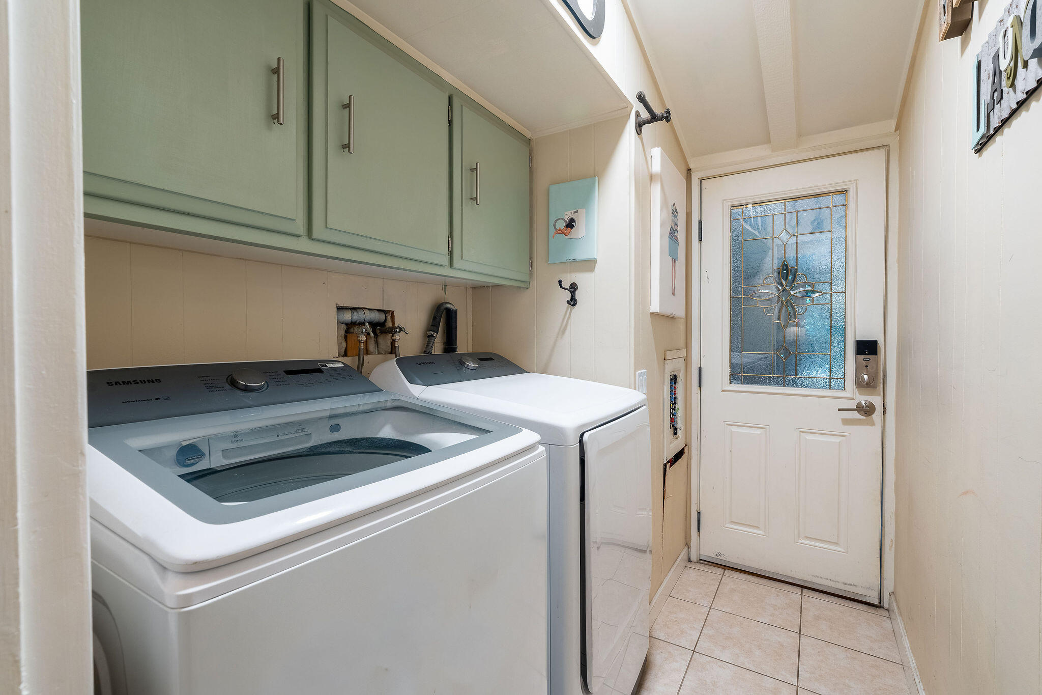 109 International Boulevard Rancho Mirage, CA 92270 - Photo 22 of 64 a utility room with dryer and washer