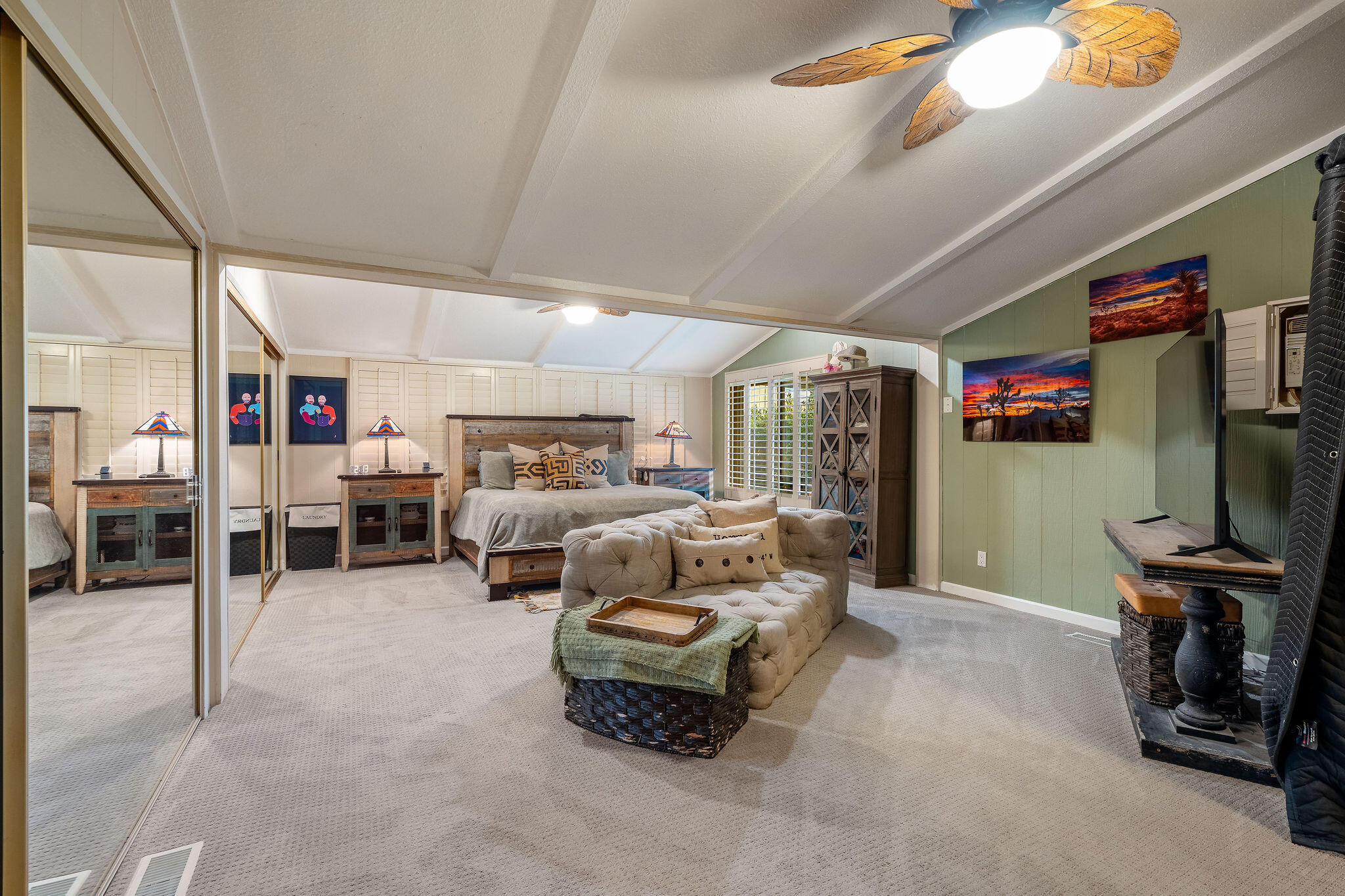 109 International Boulevard Rancho Mirage, CA 92270 - Photo 23 of 64 a living room with furniture and a flat screen tv