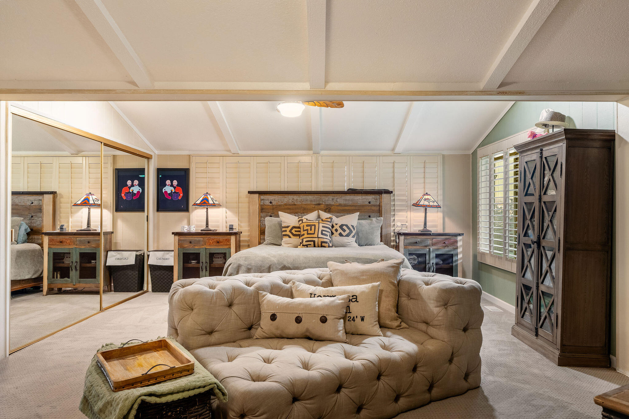 109 International Boulevard Rancho Mirage, CA 92270 - Photo 26 of 64 a bedroom with a bed and a couch