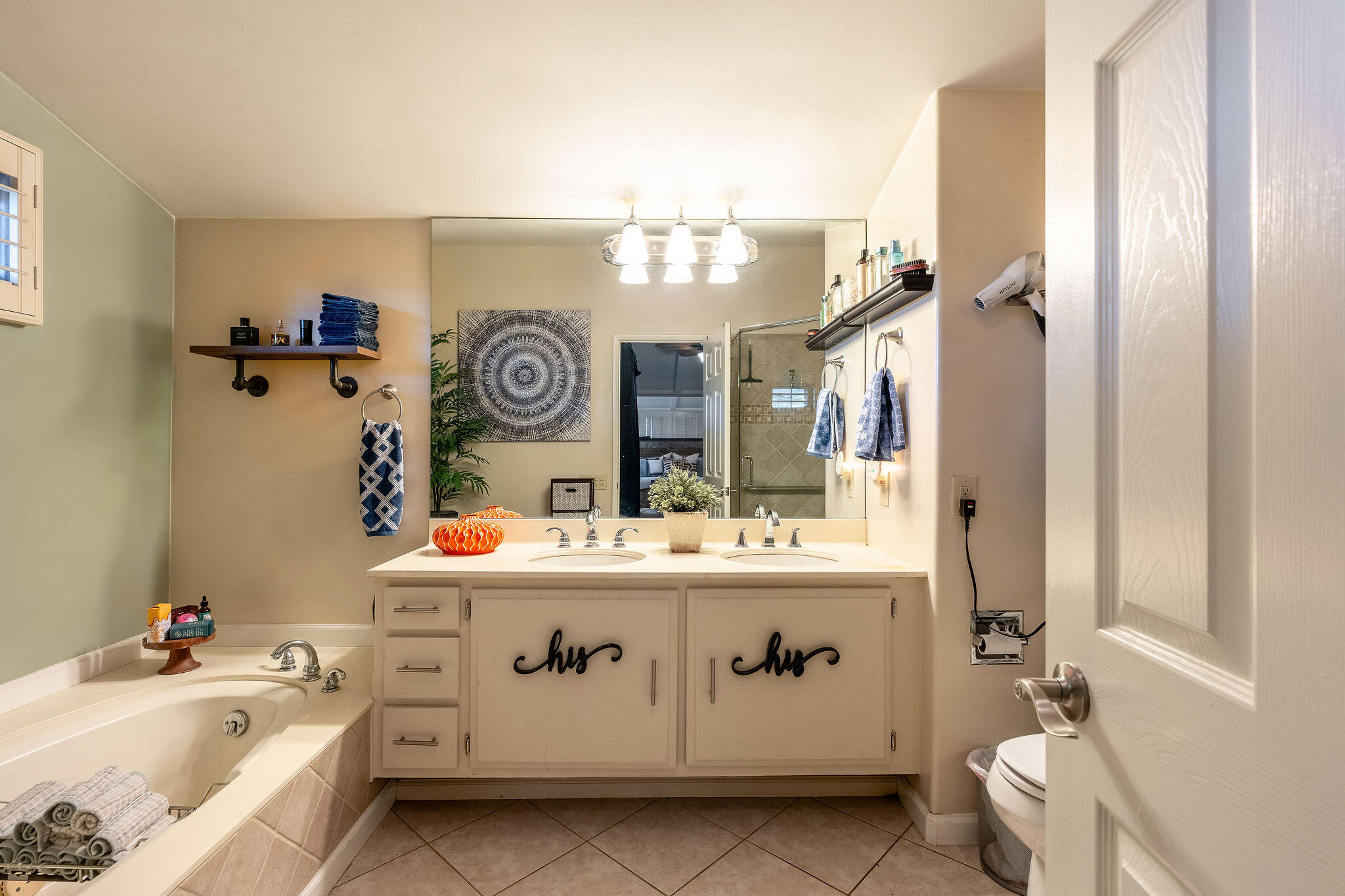109 International Boulevard Rancho Mirage, CA 92270 - Photo 27 of 64 a view of bathroom with a sink and a mirror
