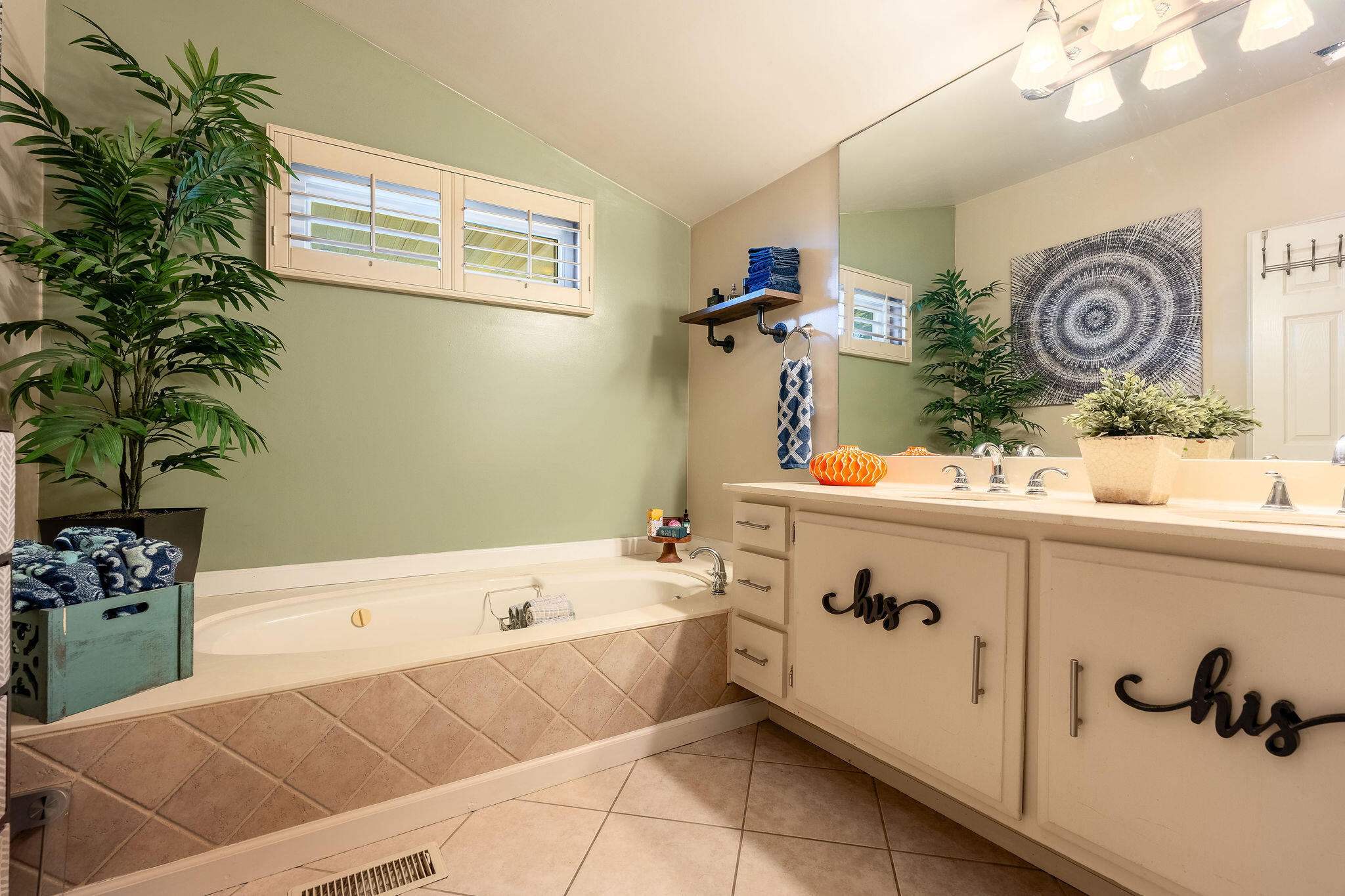 109 International Boulevard Rancho Mirage, CA 92270 - Photo 28 of 64 a bathroom with a tub sink and mirror
