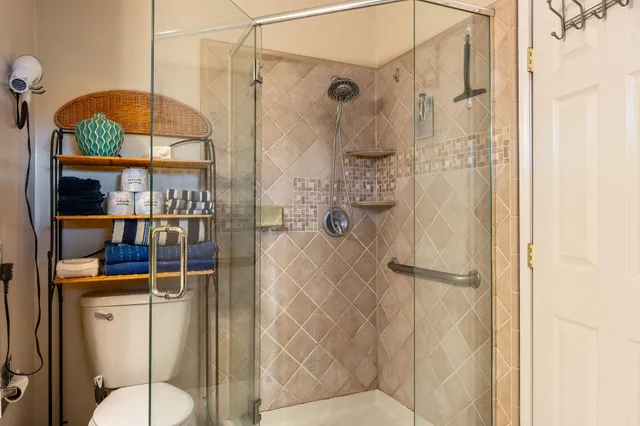 a bed room with a bed and a chair