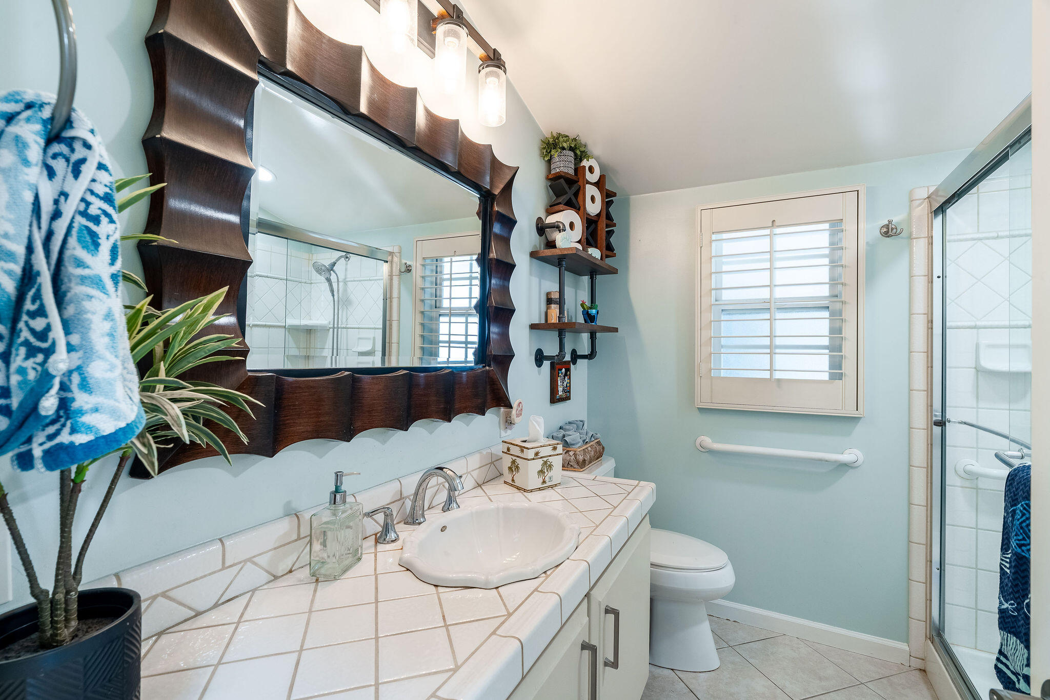 109 International Boulevard Rancho Mirage, CA 92270 - Photo 31 of 64 a bathroom with a granite countertop sink a toilet and mirror
