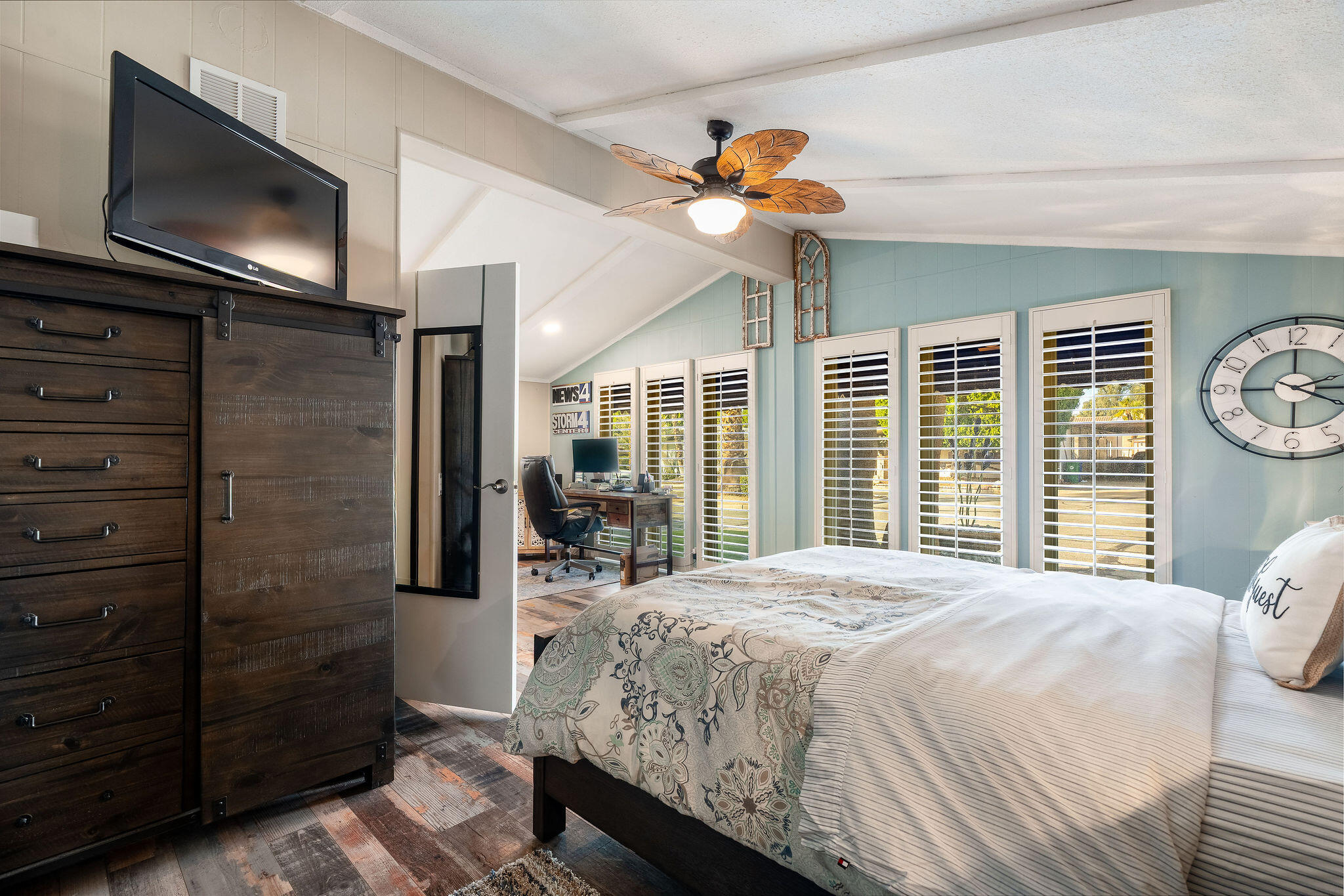 109 International Boulevard Rancho Mirage, CA 92270 - Photo 36 of 64 a bedroom with a bed and a flat tv screen on dresser